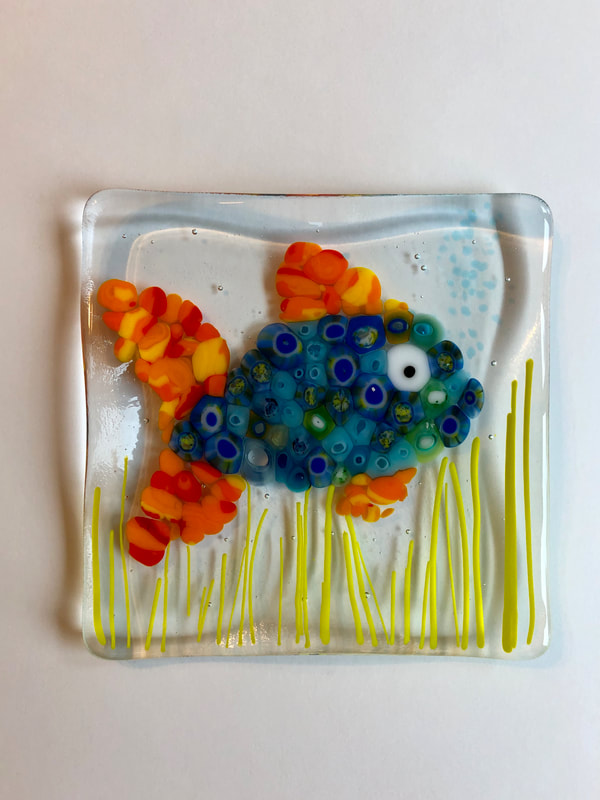 Glass tile art featuring a fish.