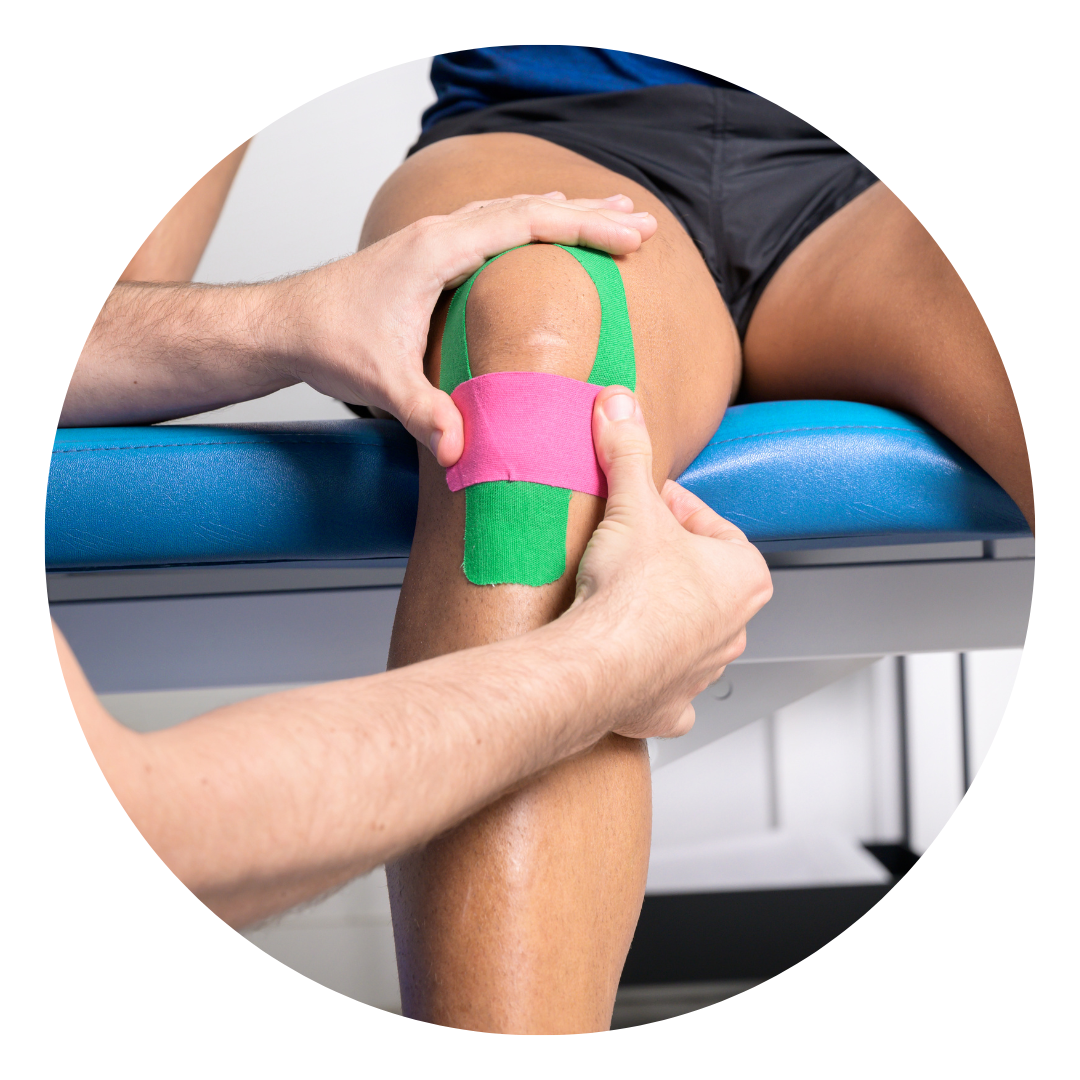 A kinesiologist applying sports tape to a patient's knee.