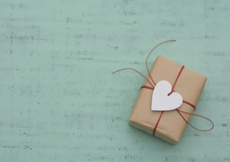 A gift wrapped up with a heart tag