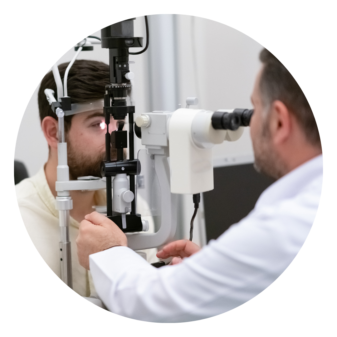 An optometrist checking a man's eyes