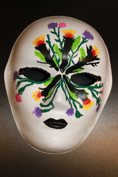 Sabrina - My mask shows the battle between being positive and hopeful, and loss and despair. 
